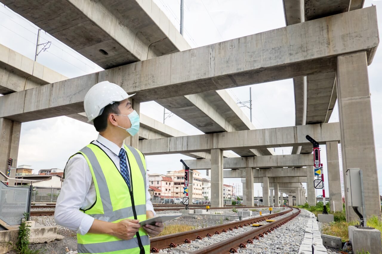 inspection engineer is checking on infrastructure and construction site.