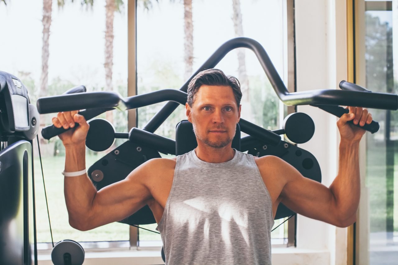 Handsome man workout in the gym. Bodybuilding and fitness, healthy lifestyle