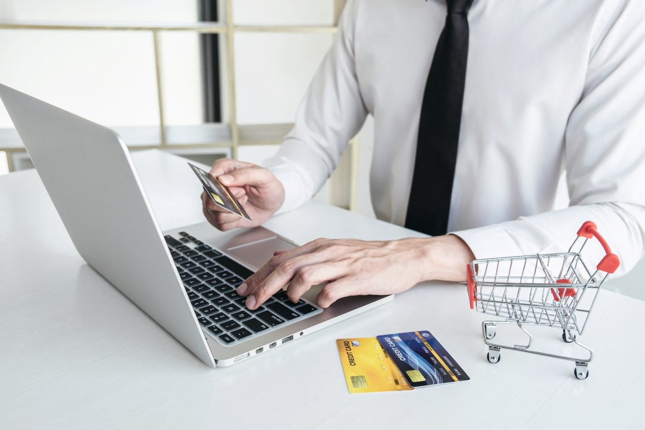 Man using credit card register security code payments online sho