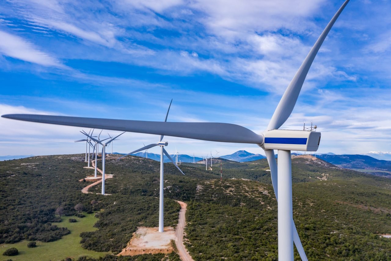 Wind turbines, renewable energy on a green hill. Wind farm